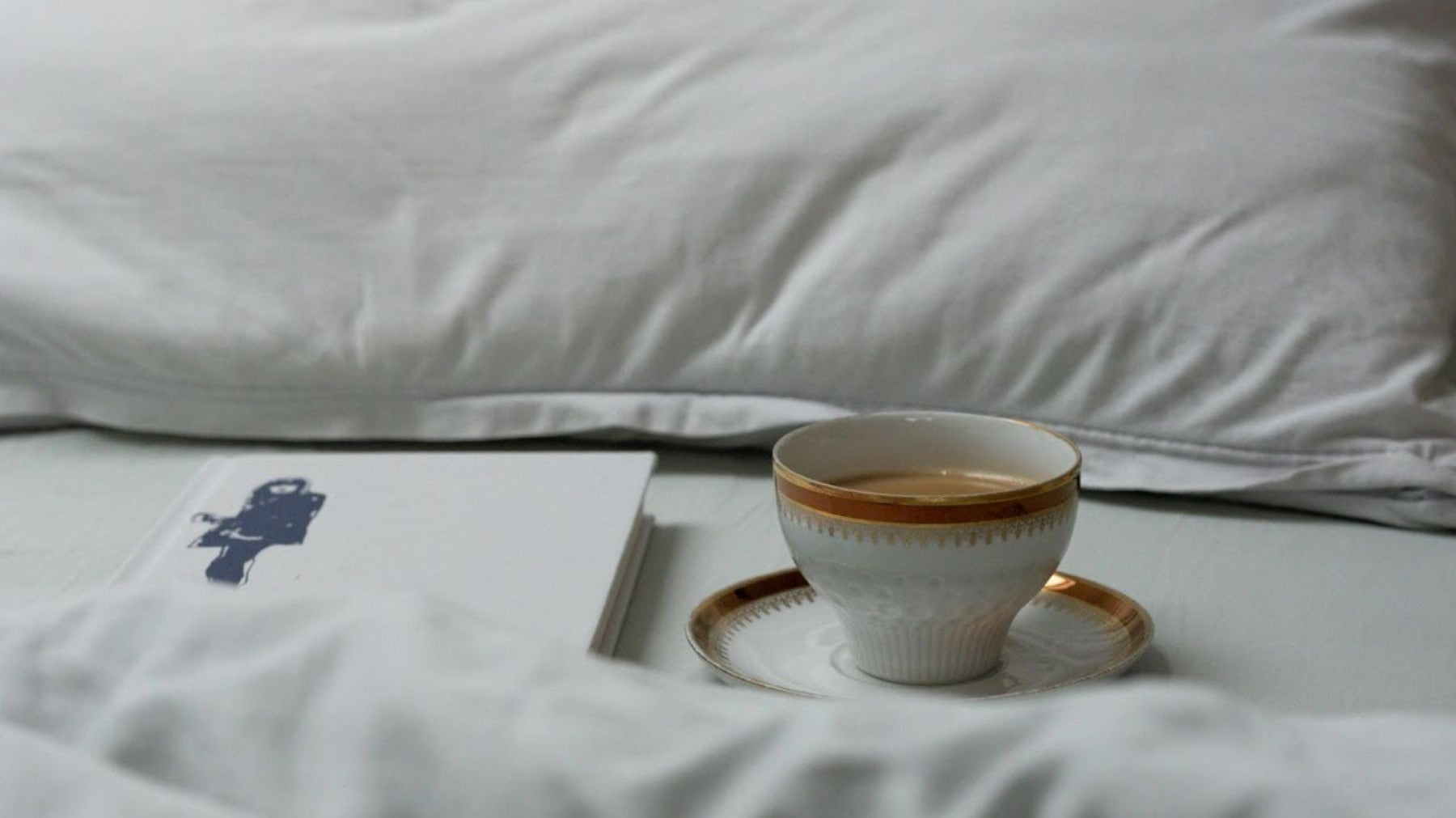 A cup of Tea on a bed