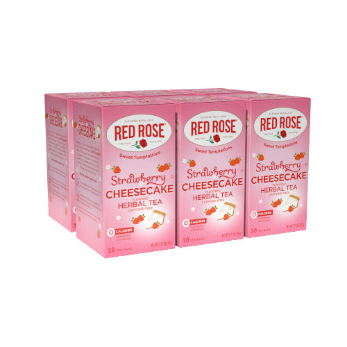 Six boxes of Red Rose Strawberry Cheesecake herbal tea on a white background
