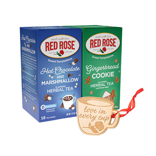 Two Red Rose tea boxes, Hot Chocolate and Marshmallow Herbal Tea and Gingerbread Cookie Herbal Tea, with a decorative tea cup ornament on a white background.