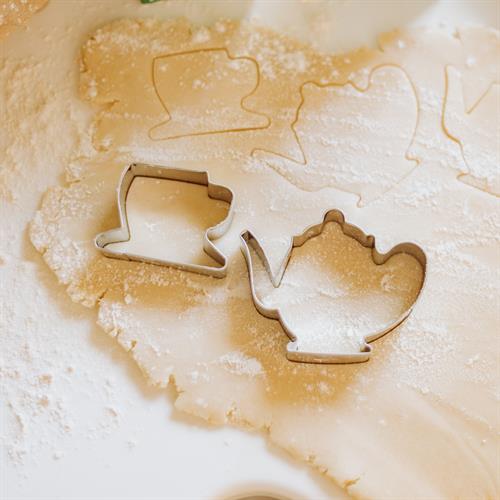 Teacup and Teapot cookie cutters in sugar cookie dough