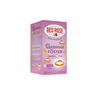 Pink box of Red Rose Bananas Foster flavored herbal tea on a white background