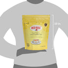 Yellow package of Red Rose Earl Grey tea on a gray background with dimensions indicated.