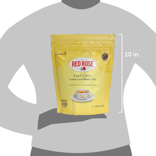 Yellow package of Red Rose Earl Grey tea on a gray background with dimensions indicated.