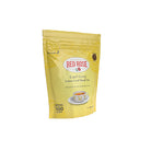 Yellow package of Red Rose Earl Grey tea on a white background