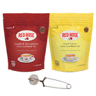 Two Red Rose tea packages, one red English Breakfast Loose Leaf and one yellow Earl Grey Loose Leaf, on a white background with a snapball style stainless steel infuser