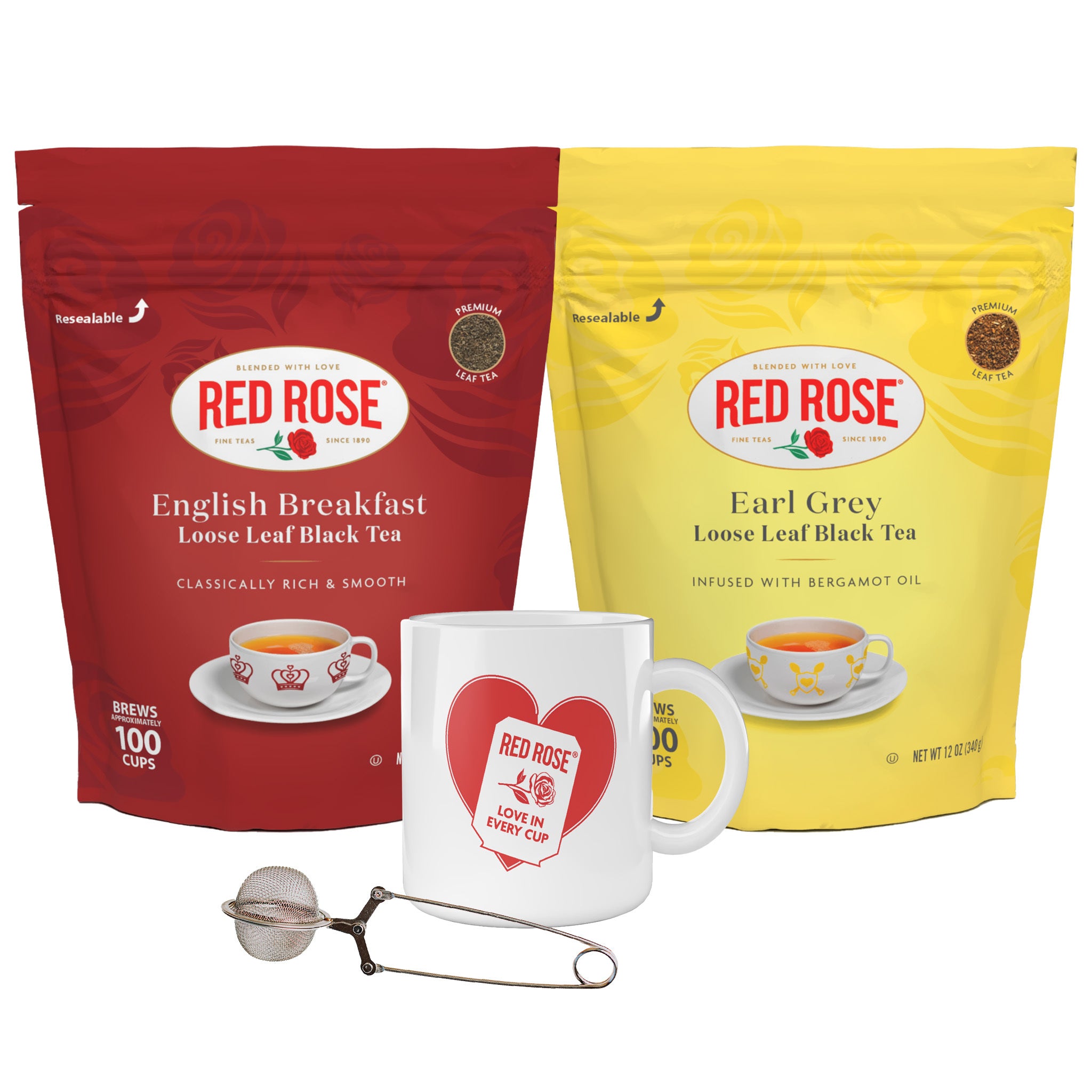 Red Rose tea gift set featuring a red bag of English Breakfast loose leaf black tea, a yellow bag of Earl Grey loose leaf black tea, a white ceramic mug with a red heart logo, and a metal tea infuser on a white background.