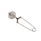 Stainless steel mesh tea ball infuser with a long handle and clasp, used for brewing loose leaf tea